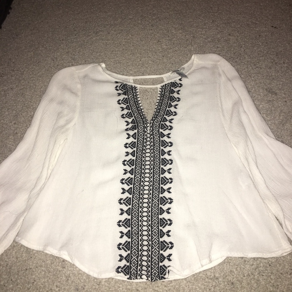 white flowy top with blue embroidery size small